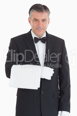 Smiling waiter holding a towel Smiling waiter holding a towel