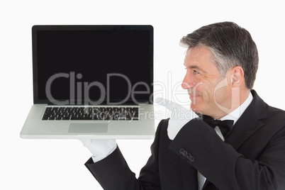 Waiter pointing to laptop