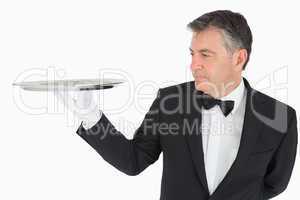 Man holding a silver tray