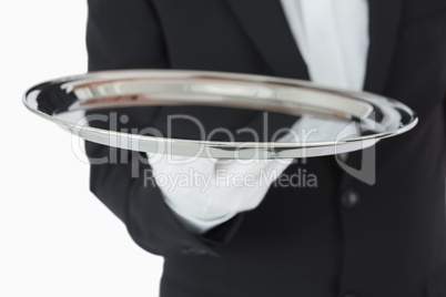 Waiter holding a silver tray