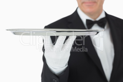 Waiter balancing silver tray