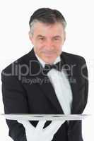 Waiter holding a silver tray out