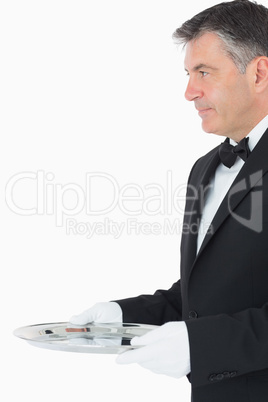 Waiter with a larger silver tray