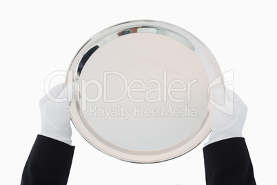 Silver tray being held out