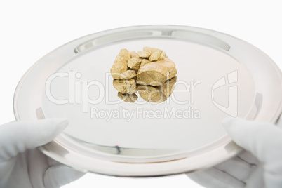 Golden nuggets on a silver tray