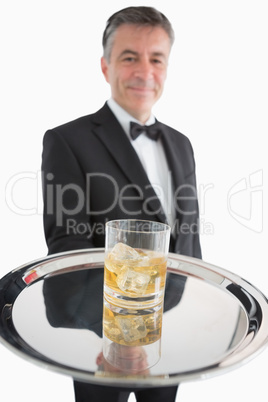 Whiskey on the rocks on a silver tray