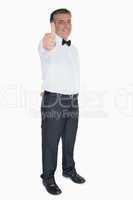 Man in suit showing thumb up