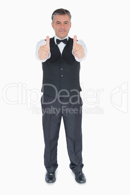 Man in suit with thumbs up