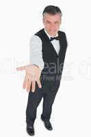 Waiter holding hand out to front