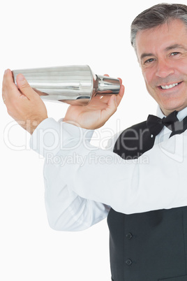 Barman mixing cocktail