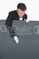 Waiter showing something on the board