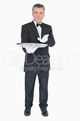 Man showing us something on silver tray