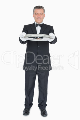 Waiter showing us empty tray