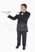 Waiter presenting empty tray