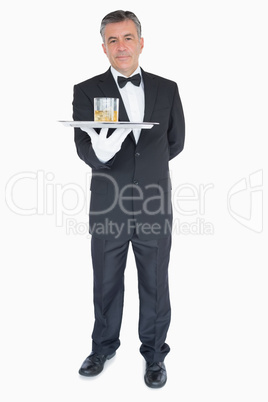 Man holding tray with glasses of whiskey