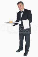 Waiter offering whiskey with ice