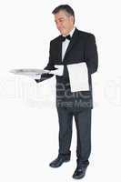 Waiter offering something on tray