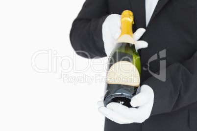 Waiter presenting champagne bottle