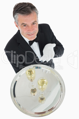 Waiter offering tray with glasses of champagne