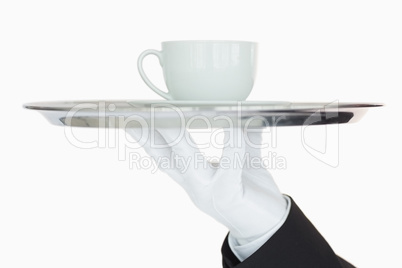 Silver tray with cup of coffee