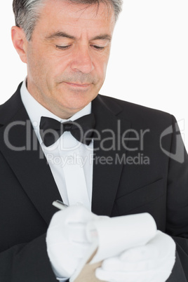 Waiter writing into his notebook