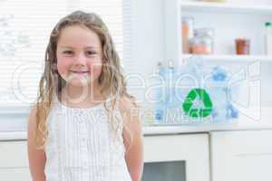Smiling girl standing in kitchen