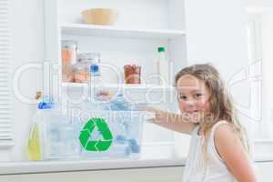 Girl sorting plastics into crates