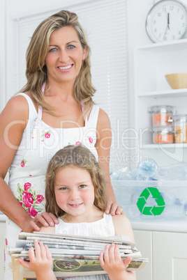 Mother standing behind her daughter