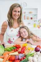 Mother and daughter standing at the table