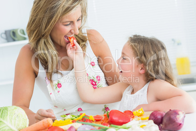 Daughter feeding her mother