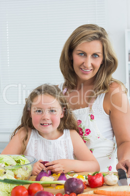 Daughter and mother looking directly into the camera