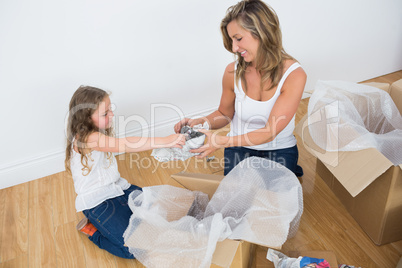 Mother and daughter unpacking things