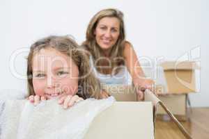 Girl sitting in box