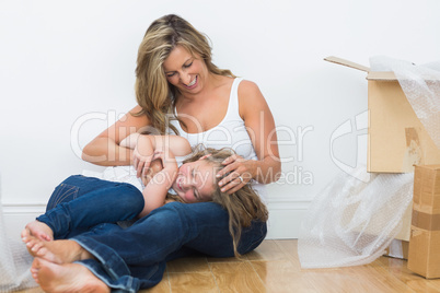 Daughter resting on the mother's legs