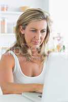 Content woman using laptop