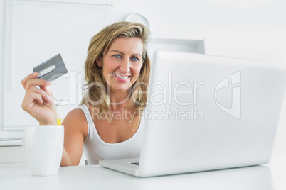 Woman using laptop for online shopping