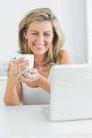 Smiling woman holding a mug