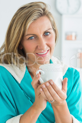 Woman in dressing gown looking directly into the camera