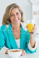 Woman holding glass of juice