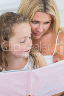 Mother and daughter reading together