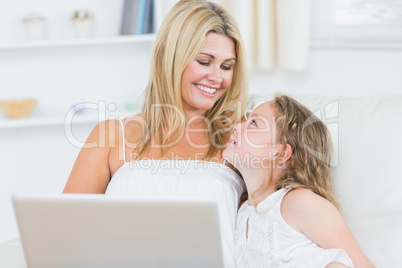 Mother and daughter resting on the sofa Mother and daughter resting on the sofa