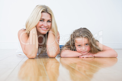 Mother and daughter resting on the floor