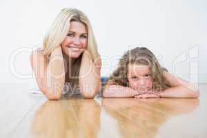 Mother and daughter resting on the floor
