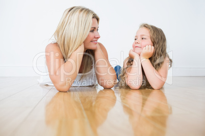 Resting mother and daughter on the floor
