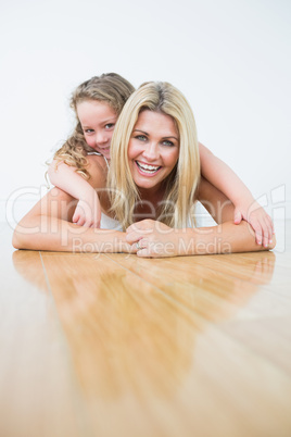 Mother and her daughter resting on the floor