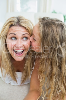 Daughter kissing her mother