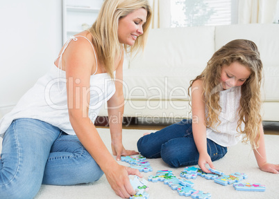 Mother and daughter doing a jigsaw