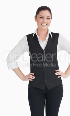 Woman in suit standing against the white background