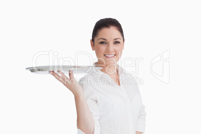 Smiling woman holding tray