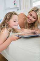 Daughter and mother using tablet